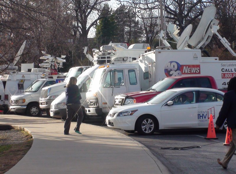 Live trucks set up outside Razorback Stadium for Bret Bielema's introduction as head coach. 