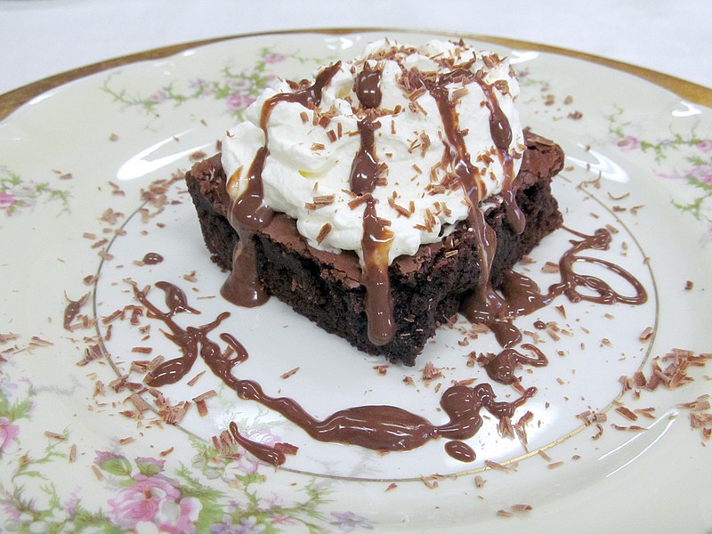 National Brownie Day will be observed Saturday. The truly American dessert is made simply of cocoa, butter, eggs and flour but can be enhanced with a variety of ingredients, such as nuts, whipped cream, flavorings and additional chocolate.