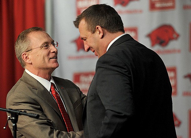 NWA Media/MICHAEL WOODS --12/05/2012-- Bret Bielema, the new University of Arkansas head football coach is introduced by athletics director Jeff Long during a press conference Wednesday afternoon. 