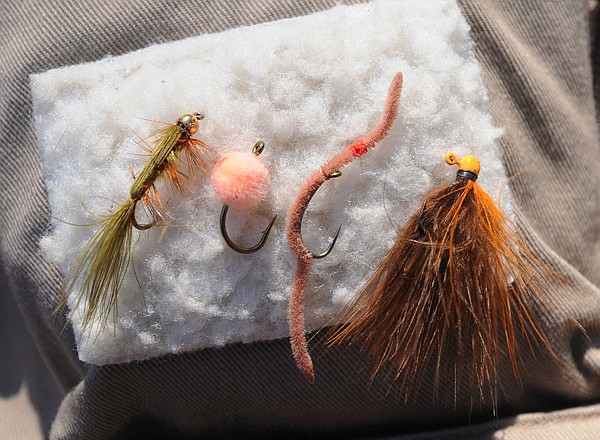Effective patterns for Roaring River fly fishing include, from left, woolly bugger, egg, San Juan worm and PJ’s Finesse Jig in 1/125th-ounce size. 