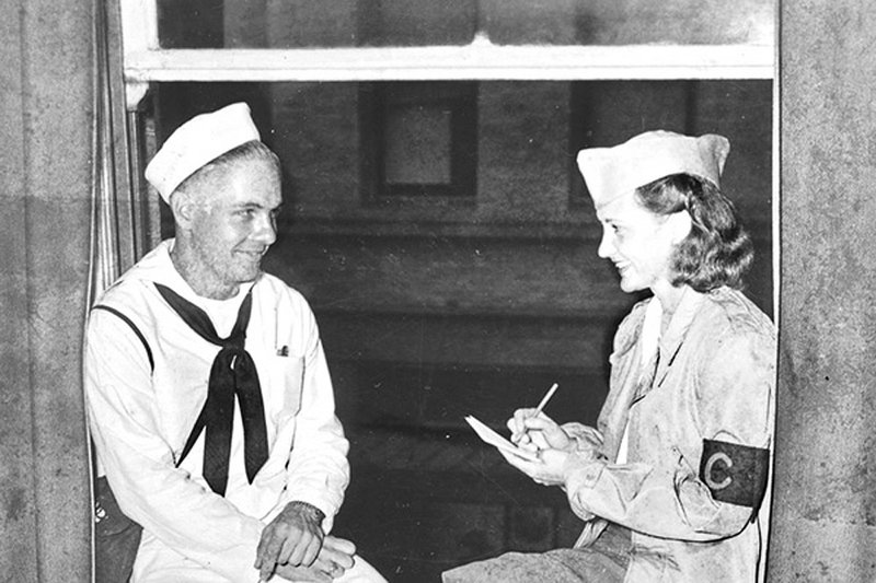 Elizabeth P. McIntosh interviews a sailor in Honolulu for the Honolulu Star-Bulletin in this undated file photo. 
