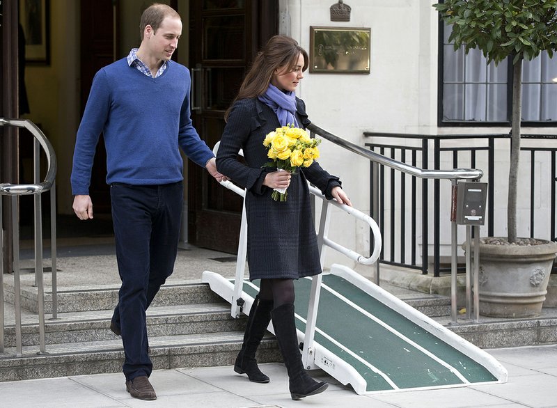 In this Thursday, Dec. 6, 2012 file photo, Britain's Prince William stand next to his wife, Kate, Duchess of Cambridge, as she leaves the King Edward VII hospital in central London. Prince William and his wife Kate are expecting their first child, and the Duchess of Cambridge was admitted to hospital suffering from a severe form of morning sickness in the early stages of her pregnancy. King Edward VII hospital says a nurse involved in a prank telephone call to elicit information about the Duchess of Cambridge has died. The hospital said Friday, Dec. 7, 2012, that Jacintha Saldanha had been a victim of the call made by two Australian radio disc jockeys. 