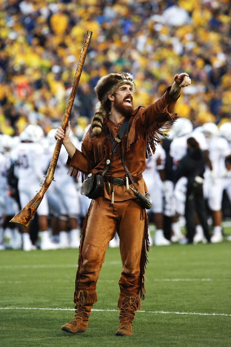 West Virginia Mountaineers mascot Jonathan Kimble has been ordered to stop using his musket for hunting after a video showing him killing a bear was posted online. 