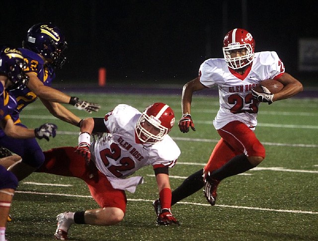 Glen Rose running back Carlos Burton (23) turns the corner as Austin Kehner (22) blocks during a game at Fountain Lake in October. Burton, a sophomore, rushed for 1,847 yards and 23 touchdowns on 171 carries this season. 