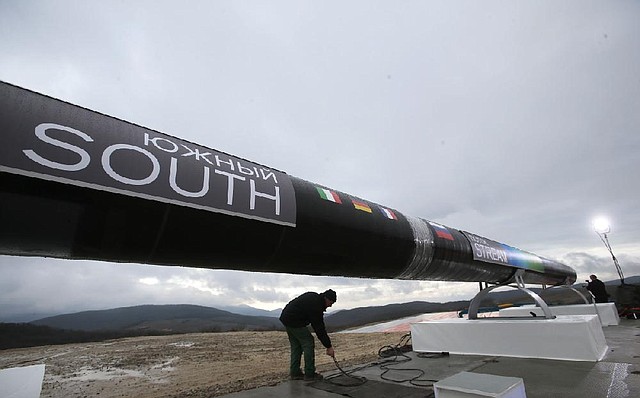 A worker prepares for a ceremony Friday marking the start of construction of the South Stream pipeline in Anapa, Russia. 