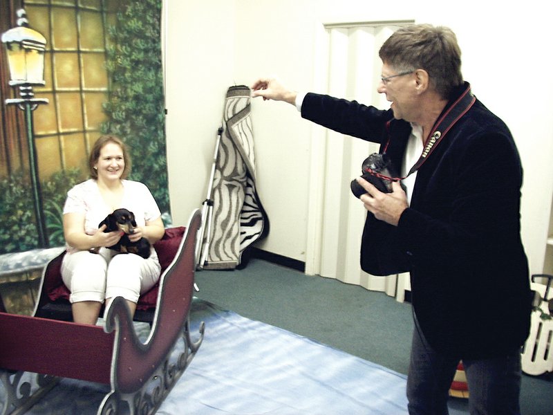 Cindy Herron of Batesville and her dog, Snickers, get their holiday portrait taken by Matthew Schuetz for a recent fundraiser for the Humane Society of Independence County.