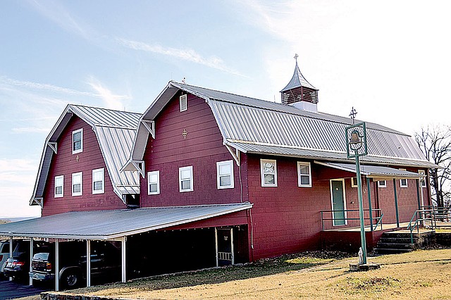 The offices of Hillspeak’s ministries are located in twin red barns atop Grindstone Mountain in Eureka Springs.