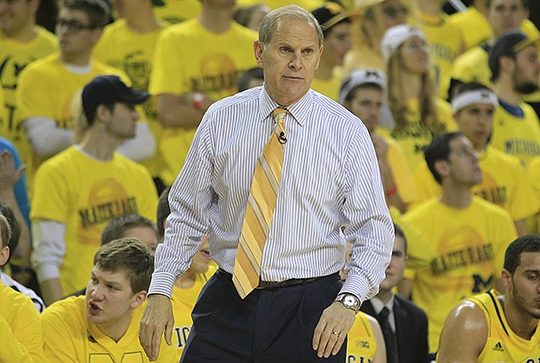 Michigan head coach John Beilein watches from the sidelines during the first half of an NCAA college basketball game against Arkansas in Ann Arbor, Mich., Saturday, Dec. 8, 2012. (AP Photo/Carlos Osorio)