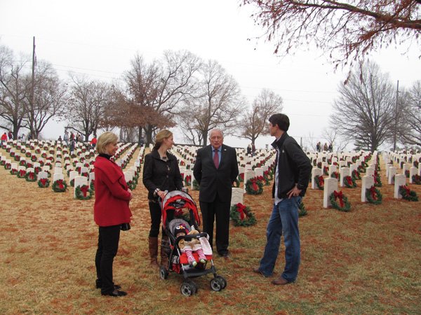 Former Secret Service Agent Clint Hill (second from right), who headed first lady Jacqueline Kennedy’s protection detail on the day President John. F. Kennedy was assassinated, chats with Mollie and John Campbell and his co-author Lisa McCubbin (left) on Saturday at Fort Smith National Cemetery. 