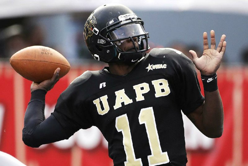 UAPB quarterback Benjamin Anderson throws to Willie Young for a 95-yard touchdown pass that tied the game at 21-21 with 2:00 left in regulation. 