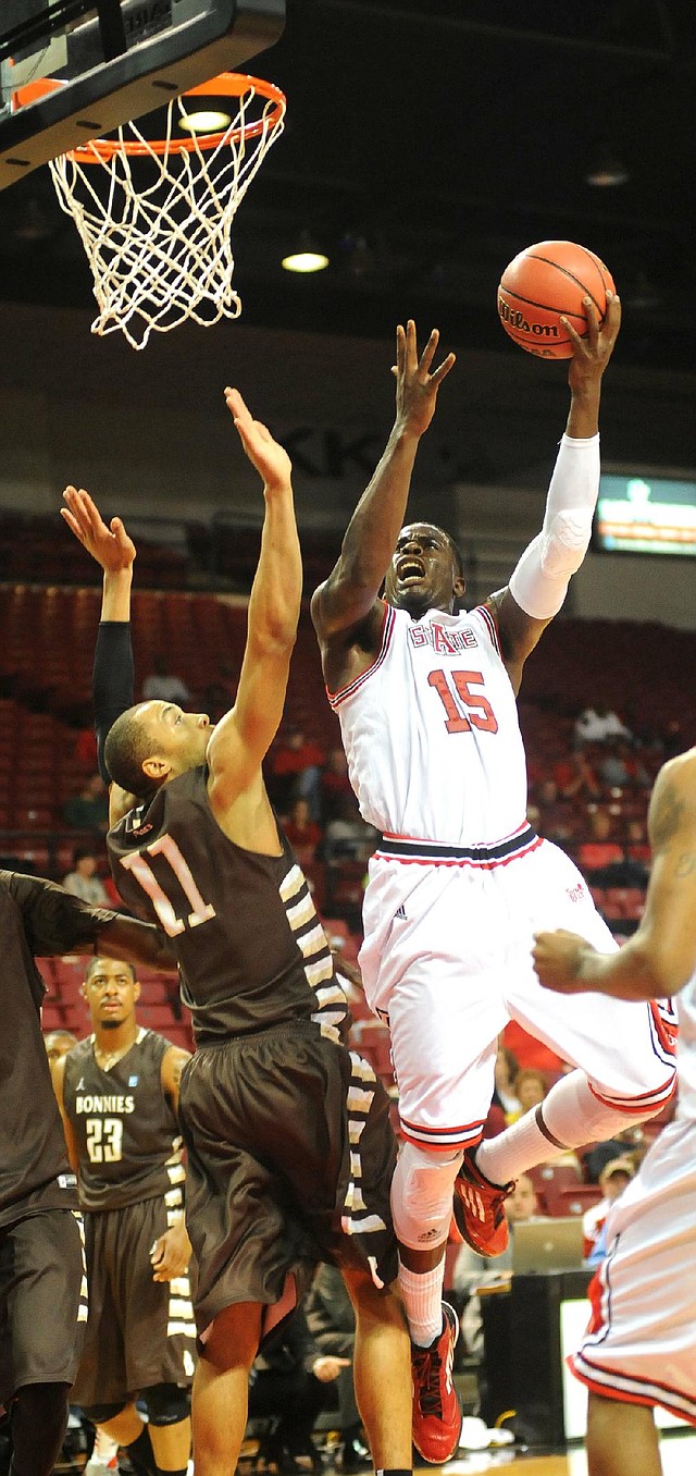 Arkansas State forward Brandon Peterson (15) shoots over St. Bonaventure defender Demitrius Conger during the first half of Saturday’s game in Jonesboro. Peterson finished with 18 points on 7-of-10 shooting and pulled down 11 rebounds as ASU won 73-70. 