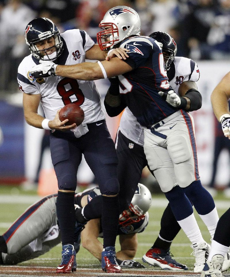 Houston Texans quarterback Matt Schaub is sacked by New England Patriots defensive end Rob Ninkovich on Monday. 
