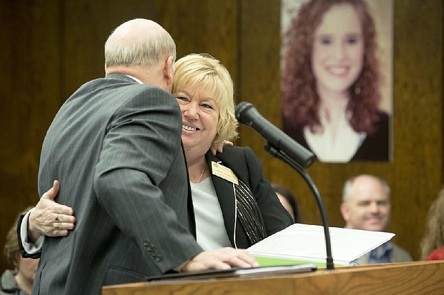 North Little Rock School District Superintendent Ken Kirspel hugs Hazel Burnett, the state’s fiscal distress coordinator, after state Board of Education members voted unanimously Monday to remove the district from fiscal distress. 