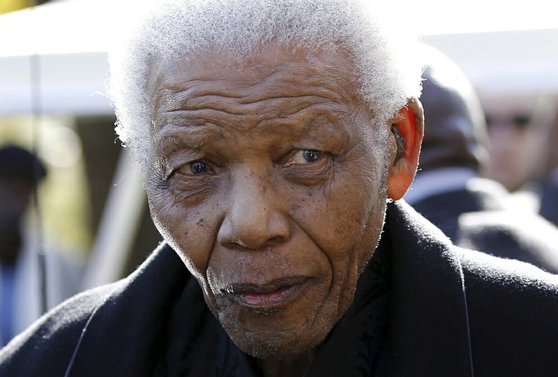 Former South African President, Nelson Mandela leaves the chapel after attending the funeral of his great-granddaughter Zenani Mandela in Johannesburg in this June 17, 2010, file photo.