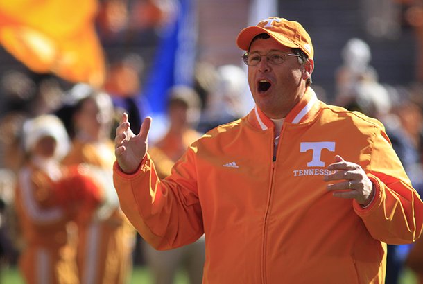 Tennessee offensive coordinator Jim Chaney, serving as interim head coach since Derek Dooley was fired after the last game, cheers for the senior class players as they take the field to play Kentucky in an NCAA college football game, Saturday, Nov. 24, 2012, in Knoxville, Tenn. The Vols won 37-17. The Vols won 37-17. (AP Photo/Chattanooga Times Free Press, Dan Henry)