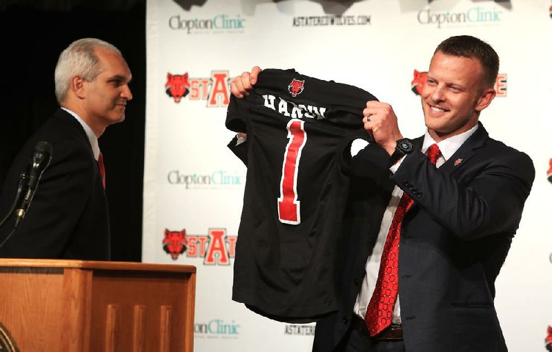 Bryan Harsin, introduced Wednesday as the new head football coach at Arkansas State, comes to the Red Wolves from Texas, where he spent two years as the co-offensive coordinator. He will be the third coach for Arkansas State in three seasons when the season opens next year. Harsin said he will not be involved in coaching Texas when it faces Oregon State in the Alamo Bowl. 