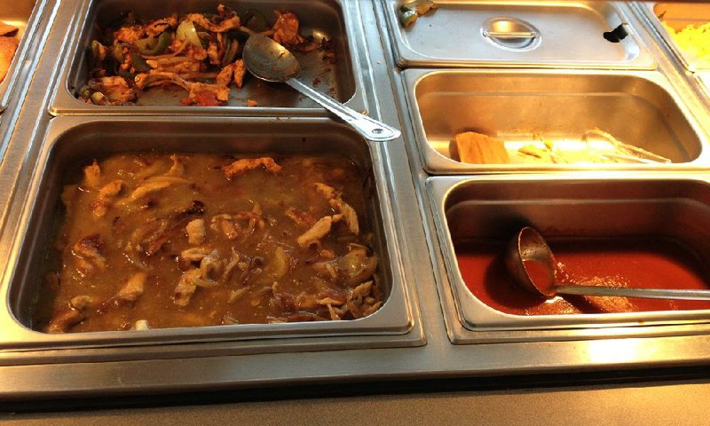 Salsa chicken (front) and chicken fajitas (back) are included on the lunch buffet at La Salsa Mexican & Peruvian Cuisine in North Little Rock. 