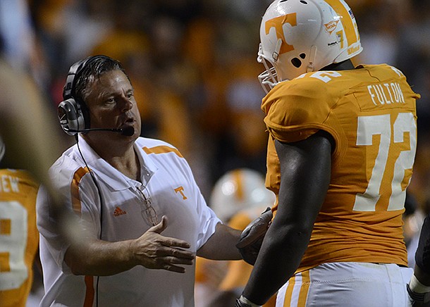 Sam Pittman talks with Tennessee offensive lineman Zach Fulton during a game against Akron at Neyland Stadium.