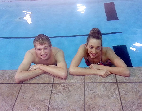 Siblings Colton and Carly Holland should play major roles for the Rogers Heritage swim team this season. 