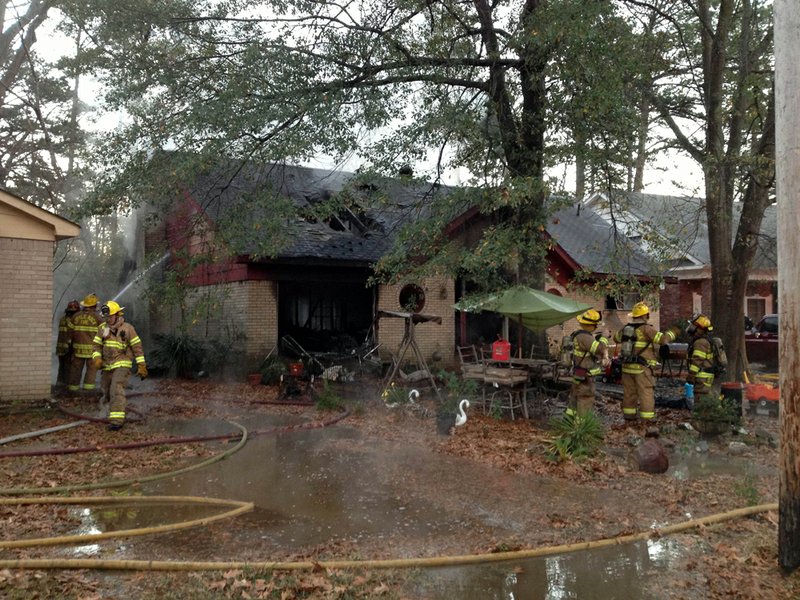 Firefighters work at 8715 Verbena Drive, where a blaze significantly damaged the home.