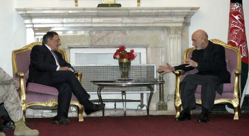 U.S. Defense Secretary Leon Panetta (left) talks Thursday with Afghanistan President Hamid Karzai at the presidential palace in Kabul. 