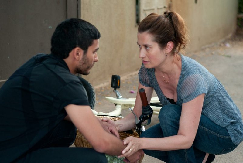 Yacine (Mehdi Dehbi) is a young Palestinian man who finds out his birth mother (Emmanuelle Devos) is a Jewish doctor living on the other side of the wall separating the occupied West Bank from Israel in Lorraine Levy’s The Other Son. 