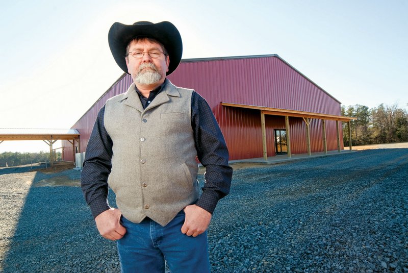 Brad Curtis is pastor of the Mountain Top Cowboy Church, which will move its congregation from a cattle sale barn to a new 15,000-square-foot facility near Heber Springs in January.