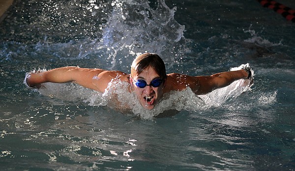 Corey Evans, 17, of Springdale Har-Ber swims the fly Tuesday during practice at The Jones Center in Springdale. Har-Ber’s next meet will be at John Brown University on Jan. 14 for the Siloam Springs Invitational.
ALL IN