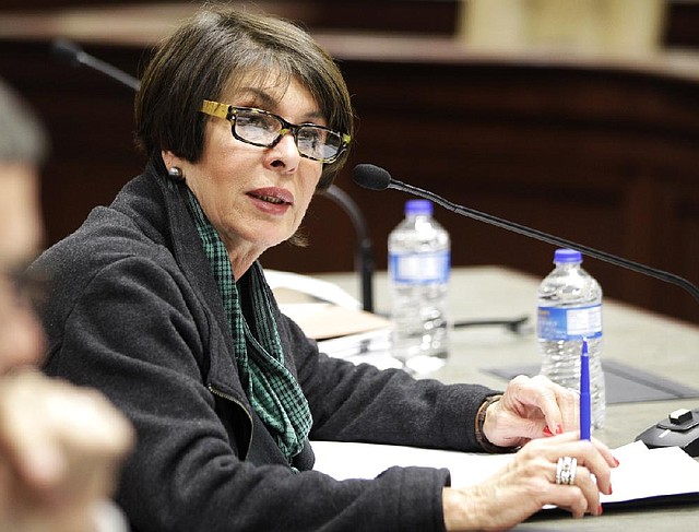 State Treasurer Martha Shoffner responds to legislators’ questions Friday during a meeting of the Legislative Joint Auditing Committee in Little Rock. Committee members quizzed her about a lack of documentation regarding the sale of bonds before maturity that auditors say cost the state more than $400,000. 