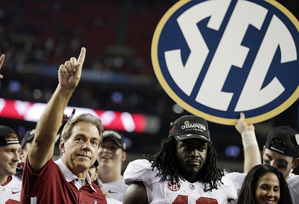 Alabama head coach Nick Saban and running back Eddie Lacy after their 32-28 win in the Southeastern Conference championship NCAA college football game against Georgia, Saturday, Dec. 1, 2012, in Atlanta. (AP Photo/David Goldman)