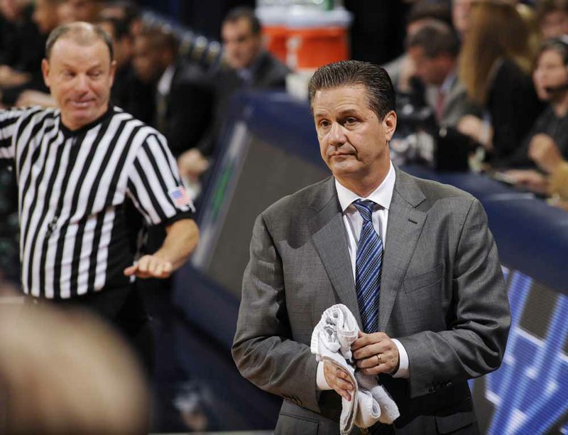 Kentucky losing three games early in the season after winning the national championship the previous season has caused a majority of its fans to give a negative approval rating to Coach John Calipari (right), according to one polling organization. 