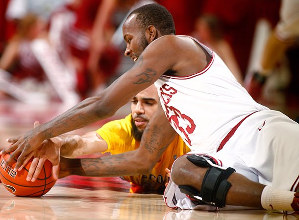 NWA Media/JASON IVESTER -- Arkansas junior Marshawn Powell and Alcorn State senior Ian Francis go after a loose ball on the floor during the first half on Saturday, Dec. 15, 2012, at Bud Walton Arena in Fayetteville.