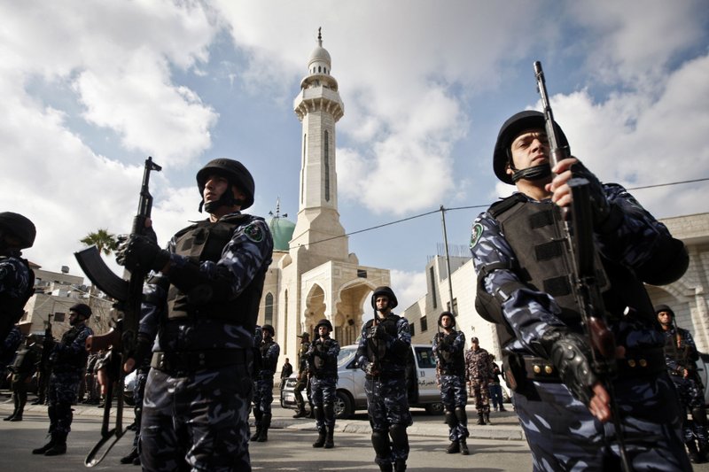 Palestinian security officers stand during a march in support of Palestinian President Mahmoud Abbas, and to celebrate their successful bid to win U.N. statehood recognition the in the West bank city of Bethlehem, Monday, Dec. 17, 2012.