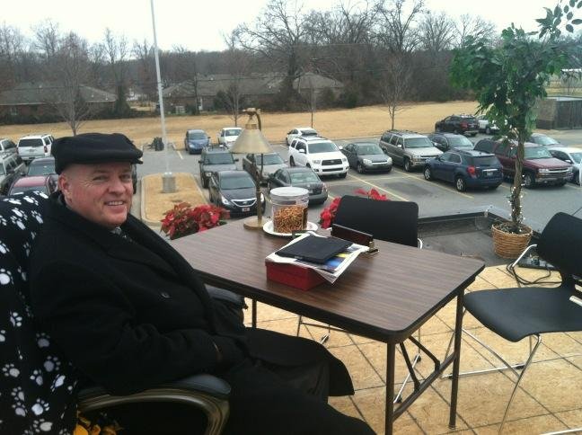Bentonville Superintendent Michael Poore working from the roof Wednesday morning.