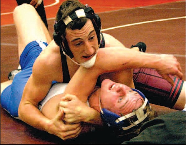 Gentry’s Cody Watson, wrestling in the 170 pound category, pins his opponent in the finals round of the Pioneer Holiday Classic wrestling tournament held at Gentry High School on Saturday. Due to an ISP issue with email, full tournament results were not available yet at press time.
Going for the Pin 