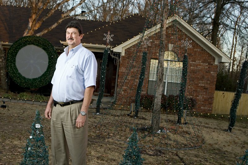 Randy Guptill provides motorists passing his home with a Christmas light show every year. Guptill uses a laptop to set thousands of lights to music, which can be heard using a radio.