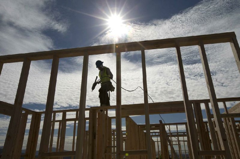 In this Friday, Nov. 16, 2012, photo, construction worker Elabert Salazar works on a house frame for a new home in Chula Vista, Calif. U.S. builders broke ground on fewer homes in November after starting work in October at the fastest pace in four years. Superstorm Sandy likely slowed starts in the Northeast. The Commerce Department said Wednesday, Dec. 19, 2012, that builders began construction of houses and apartments at a seasonally adjusted annual rate of 861,000. That was 3 percent less than October's annual rate of 888,000, the fastest since July 2008. (AP Photo/Gregory Bull)