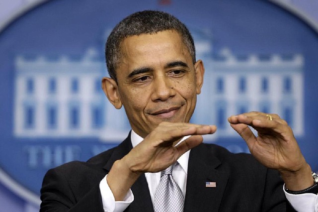 President Barack Obama gestures as he takes questions from reporters, Wednesday, Dec. 19, 2012, at the White House in Washington. (AP Photo/Charles Dharapak)