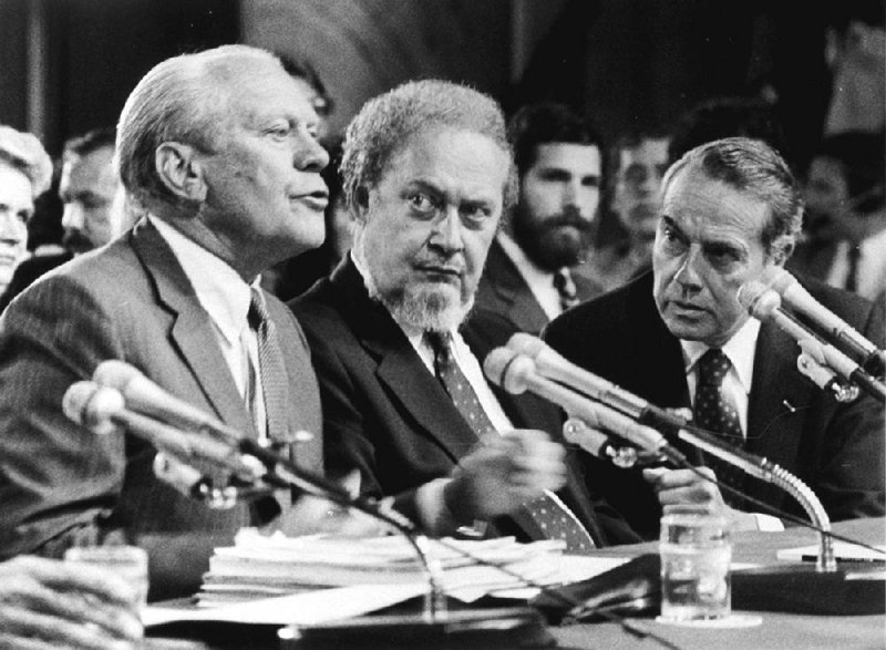 FILE - In this Sept. 15, 1987 file photo, former President Gerald Ford, left, introduces Supreme Court Associate Justice nominee Robert Bork, as the Senate Judiciary Committee began confirmation hearings on the nomination on Capitol Hill.  Ford praised Bork as being "uniquely qualified" for the post.  At right is Sen. Robert Dole, R-KS, who also made a statement on Bork.  Robert Bork, whose failed Supreme Court nomination made history, has died.  (AP Photo/Charles Tasnadi)