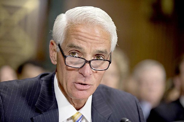 Former Florida Gov. Charlie Crist delivers a statement before the Senate Judiciary Committee as Senate Democrats and Republicans sparred over whether voter ID laws, attempts to purge voter rolls and restricted early voting were legitimate efforts to stop fraud or Republican strategies to hold down Democratic votes, on Capitol Hill in Washington, Wednesday, Dec. 19, 2012.  (AP Photo/J. Scott Applewhite)