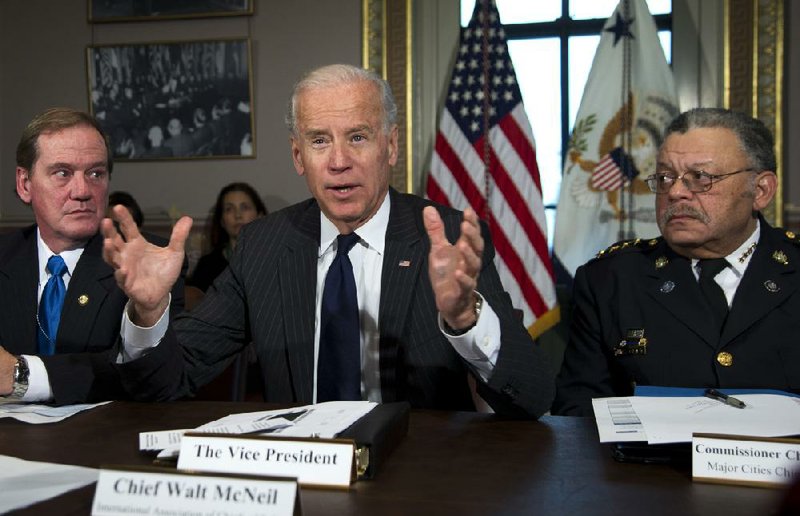 Vice President Joe Biden, flanked by Boston police officer Thomas Nee (left) and Philadelphia Police Commissioner Charles Ramsey, speaks Thursday during a gun-violence meeting with Cabinet members and police officers. 