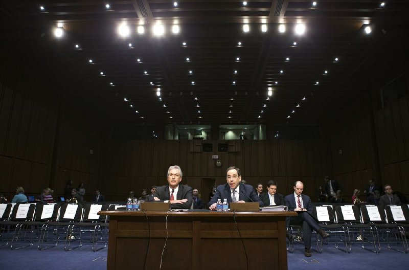 Deputy Secretary of State William Burns (left), who is in charge of policy, and Deputy Secretary of State Thomas Nides, in charge of management, appear Thursday before the Senate Foreign Relations Committee to answer questions about the attack on the consulate in Benghazi, Libya. 