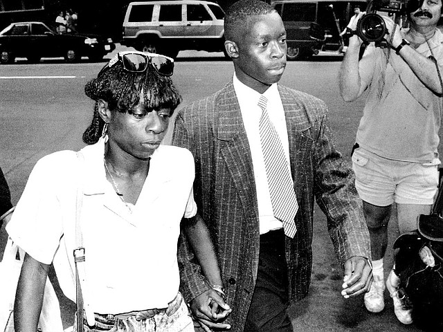 Defendant Antron McCray walks to court accompanied by his sister in this still image from The Central Park Five. 