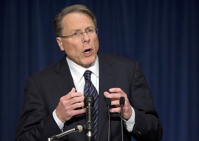 The National Rifle Association executive vice president Wayne LaPierre, gestures during a news conference in response to the Connecticut school shooting on Friday, Dec. 21, 2012 in Washington. The nation's largest gun-rights lobby is calling for armed police officers to be posted in every American school to stop the next killer "waiting in the wings."