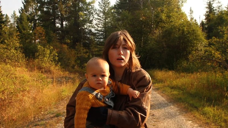 This is a still from the film Empire Builder by Kris Swanberg, one of the films by women indie directors to be screened at the 2013 Ozark Foothills FilmFest. Shown is Kate Lyn Sheil holding Jude Swanberg.