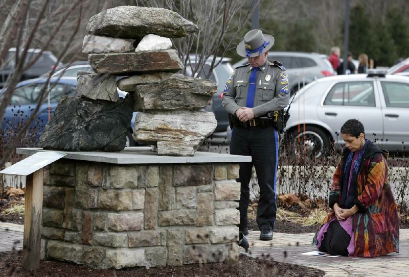 Mourners bow in prayer at the end of a funeral Friday in Bethel, Conn., for Dylan Hockley, 6, a victim of last week’s shooting at Sandy Hook Elementary School in Newtown, Conn. 