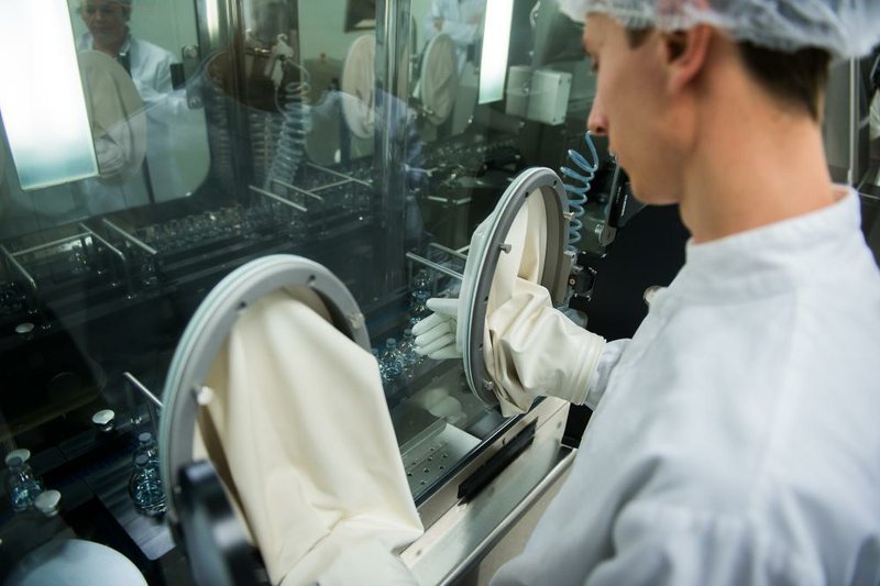 A lab technician works with sterile products during drug manufacturing at a plant owned by Teva Pharmaceuticals Industries Ltd.’s factory in Godollo, Hungary, in October. Teva is the world’s largest maker of generic drugs. 