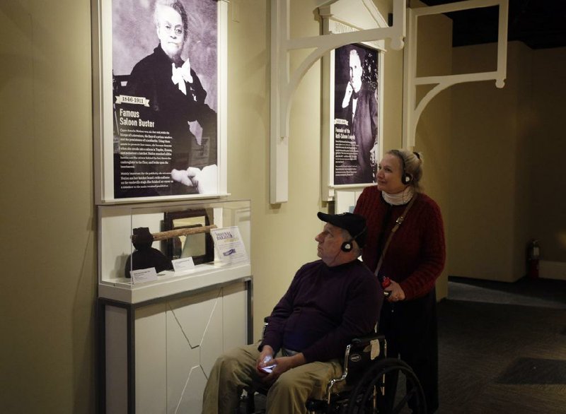 Visitors to the National Constitution Center view the hatchet of Carry Nation in the exhibit “American Spirits: The Rise and Fall of Prohibition.” 