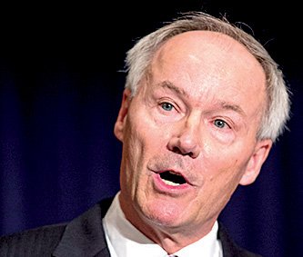 Asa Hutchinson said Friday that his “team of experts” will study “the best security solutions” for children at school, which could include armed volunteers acting as guards. 