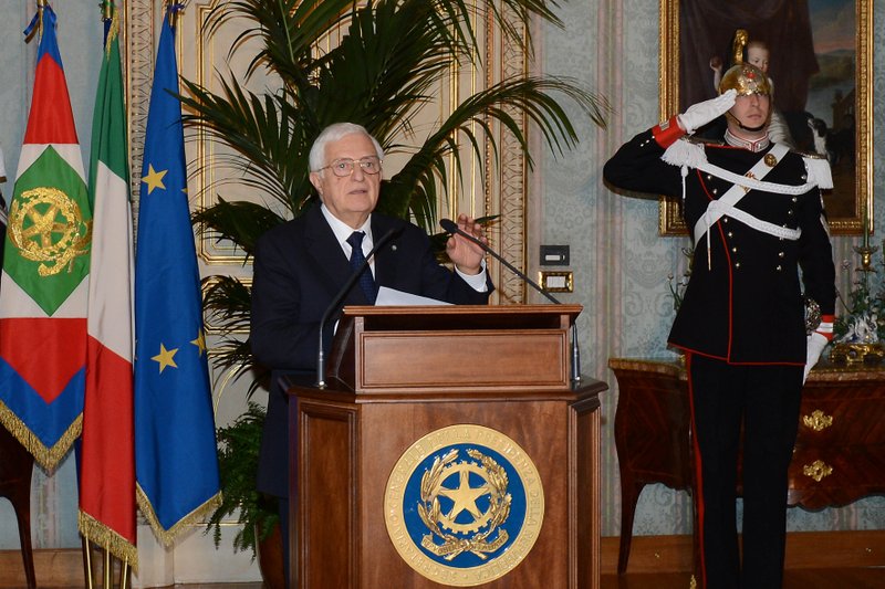 In this photo released by the Italian Presidency, the general secretary Donato Marra officially announces the resignation of Mario Monti at the Quirinale presidential palace in Rome Friday, Dec. 21, 2012. Mario Monti handed in his resignation to Italy's president in Rome on Friday, bringing to a close his 13-month technical government and preparing the country for national elections. President Giorgio Napolitano -- who tapped Monti in November 2011 to come up with reforms to shield Italy from the continent's debt crisis -- asked Monti to stay on as head of a caretaker government until the national vote, expected in February.